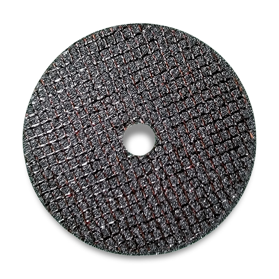 The sm cut off wheel is a round, textured cutting disc featuring a grid pattern and a central hole, specifically designed for use with power tools.