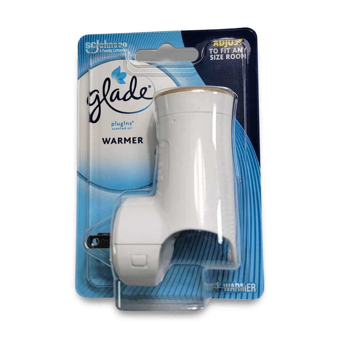 A Glade Plug In Warmer, with a white plastic design and plug-in mechanism, is showcased in front of its branded cardboard backing.