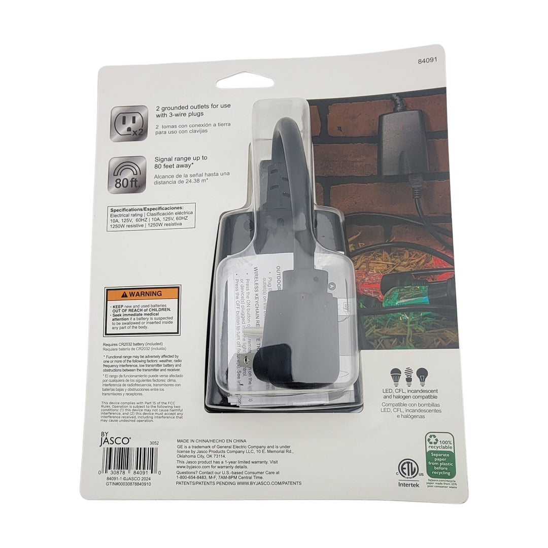 Packaging of the Outdoor Plug-in Lighting Control featuring a wireless remote outlet switch with two grounded outlets and an 80-foot range, displayed in English and Spanish, with safety warnings and visible product branding.