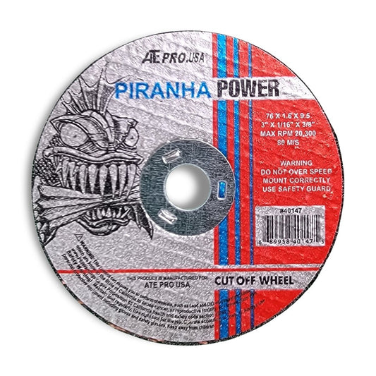 The "sm cut off wheel" is a circular metal disk branded as "Piranha Power," featuring an aggressive fish graphic. It includes information on dimensions, max RPM, and safety warnings in white, red, and blue text.