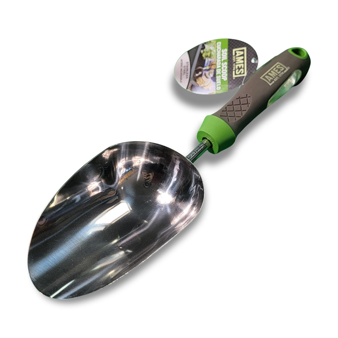 A reflective Ames Ergo Gel Grip scoop with a gray and green handle rests on a white surface, featuring an attached tag.