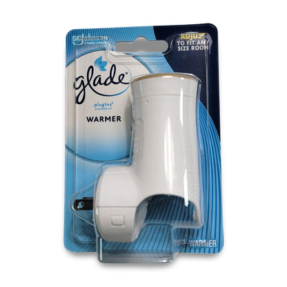 A Glade Plug In Warmer, with a white plastic design and plug-in mechanism, is showcased in front of its branded cardboard backing.