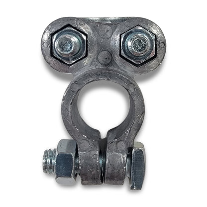 A battery terminal with a metallic clamp featuring two hexagonal bolts on top and one on the side, giving it an anthropomorphic appearance.